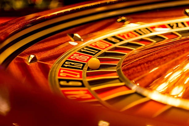 AduQ game interface showing live dealer and betting controls on desktop screen